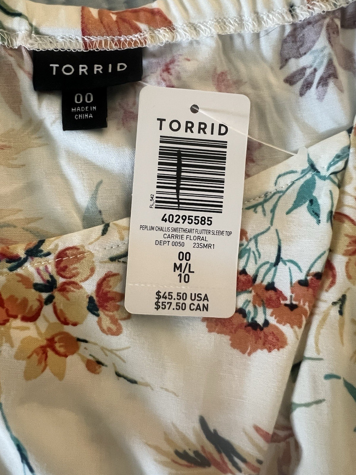 Torrid Top Women’s Size 00 M/L Cream/Multicolor floral Peplum Flutter Sleeve NWT