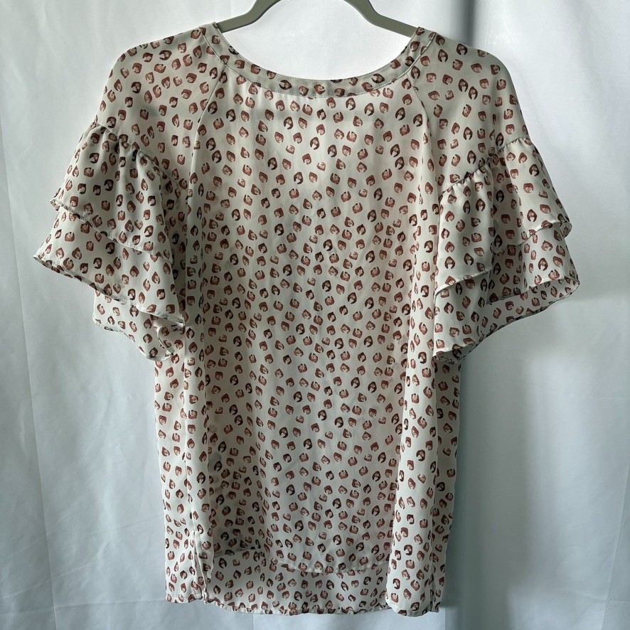 LOFT XS ruffled short sleeve blouse in cream with rust and orange splotches.