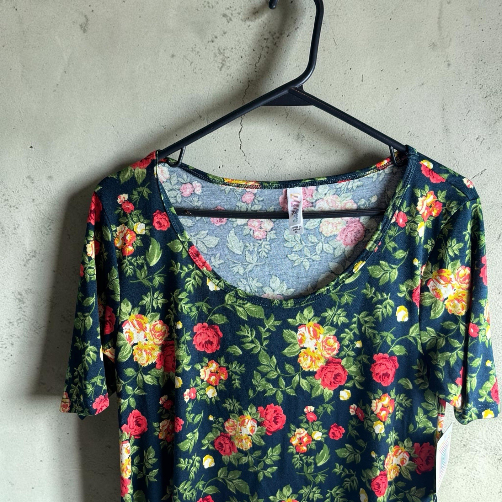 LuLaRoe Perfect T Shirt Women’s Size XS Navy Blue Red Yellow Floral Swing Top