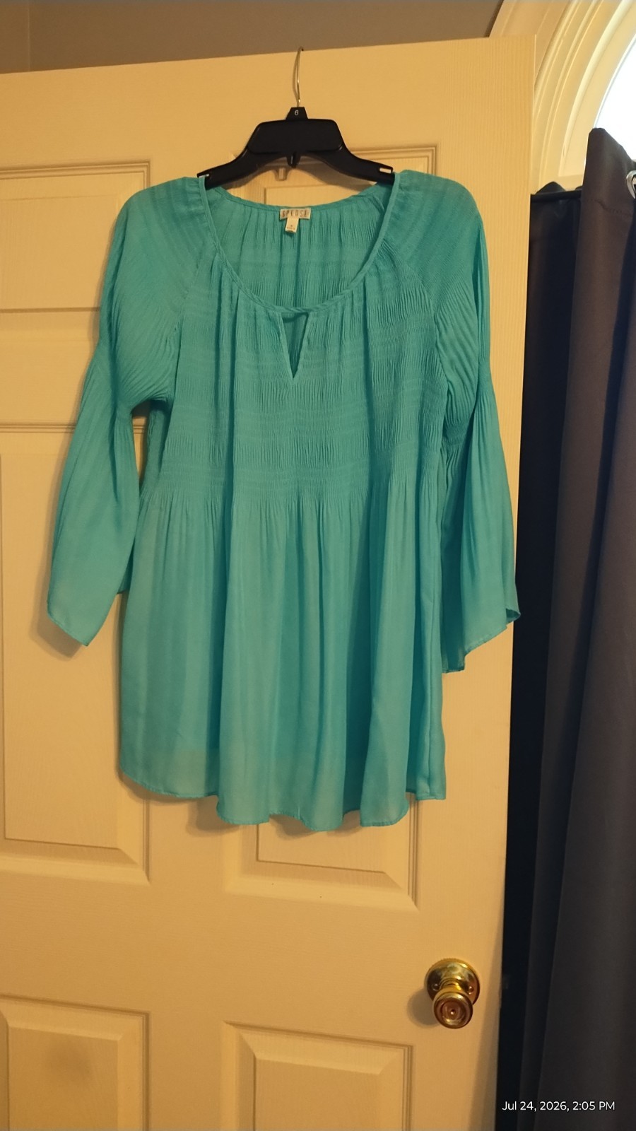 Teal smocked blouse with bell sleeves size M