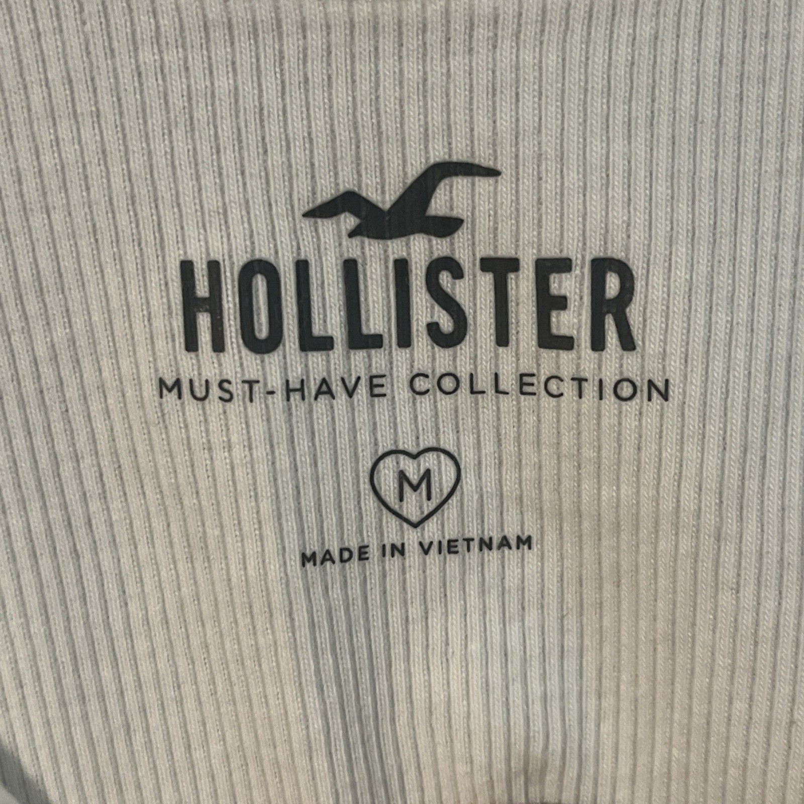 Hollister White Tank Top With Side Ties And A Blue Sun Detail Size Medium