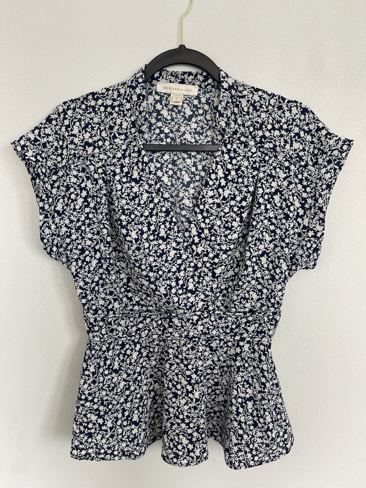 Floral blouse from Monteau Los Angeles with a wrap design and V-neck