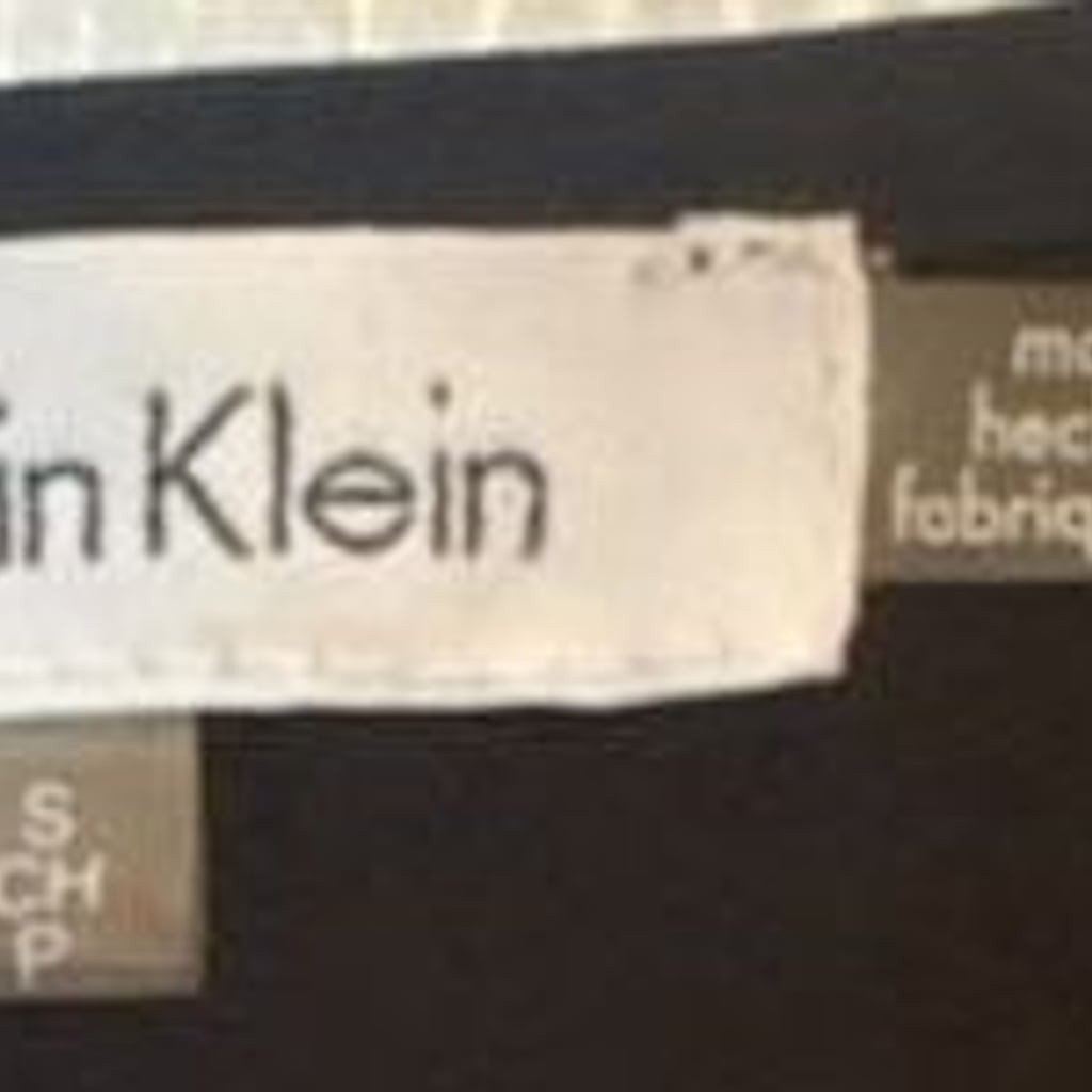 Calvin Klein Women’s Sleeveless Mixed-Print Top in Black, White, and coral Flora