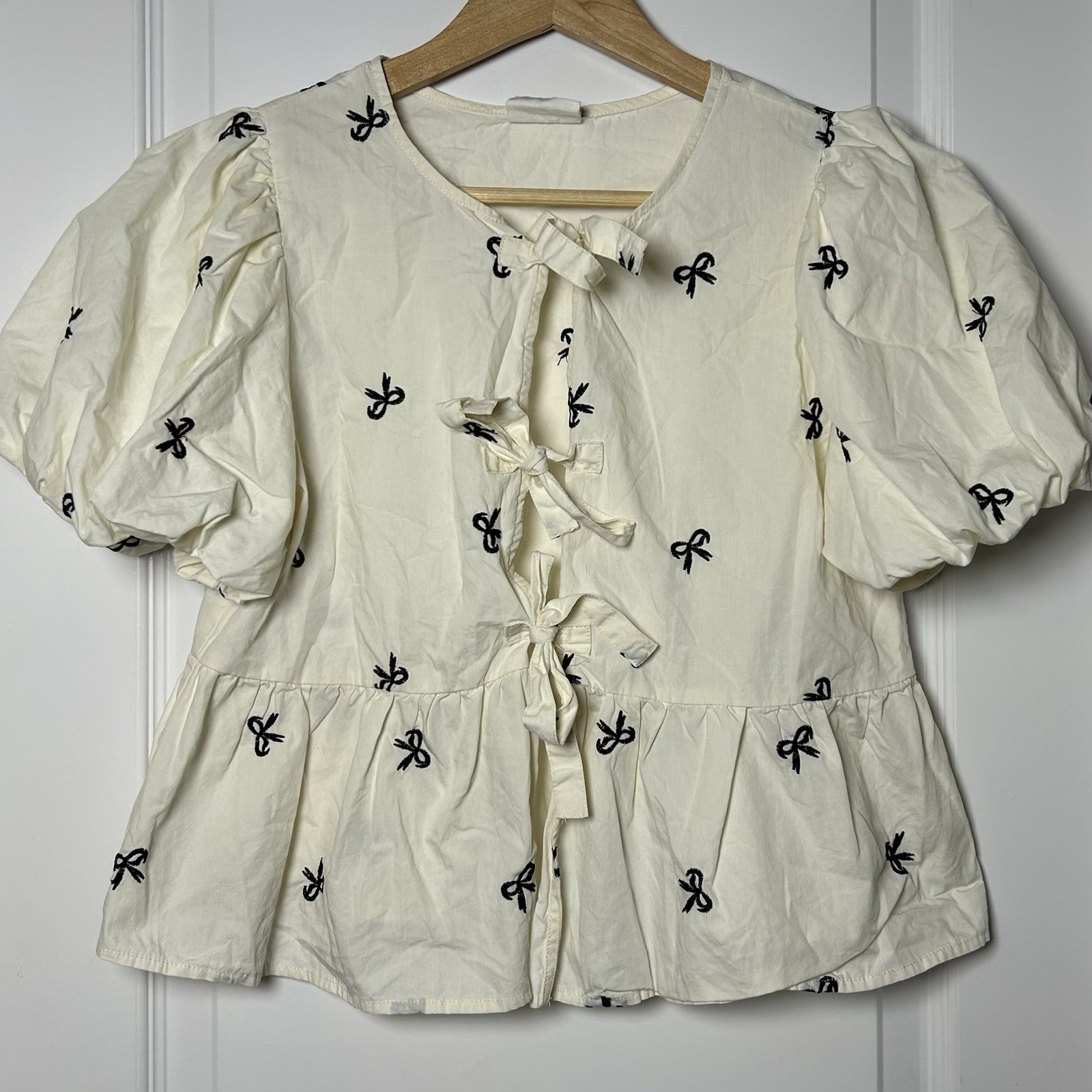 New’m Cream Embroidered Bow Print Coquette Puff Sleeve Tie Front Peplum Blouse