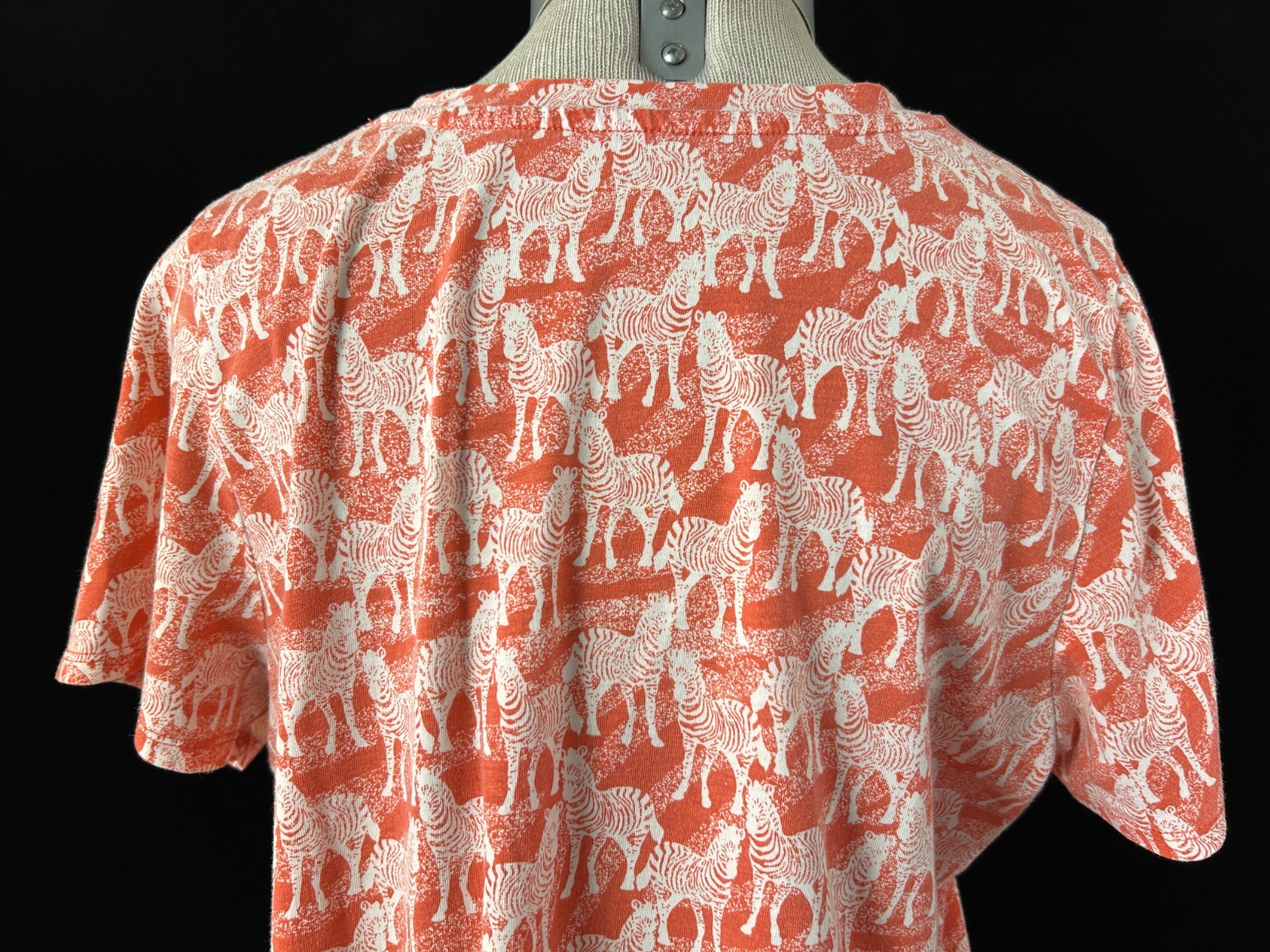 Orange & white top with zebra pattern blouse Size L V neck short sleeve pullover
