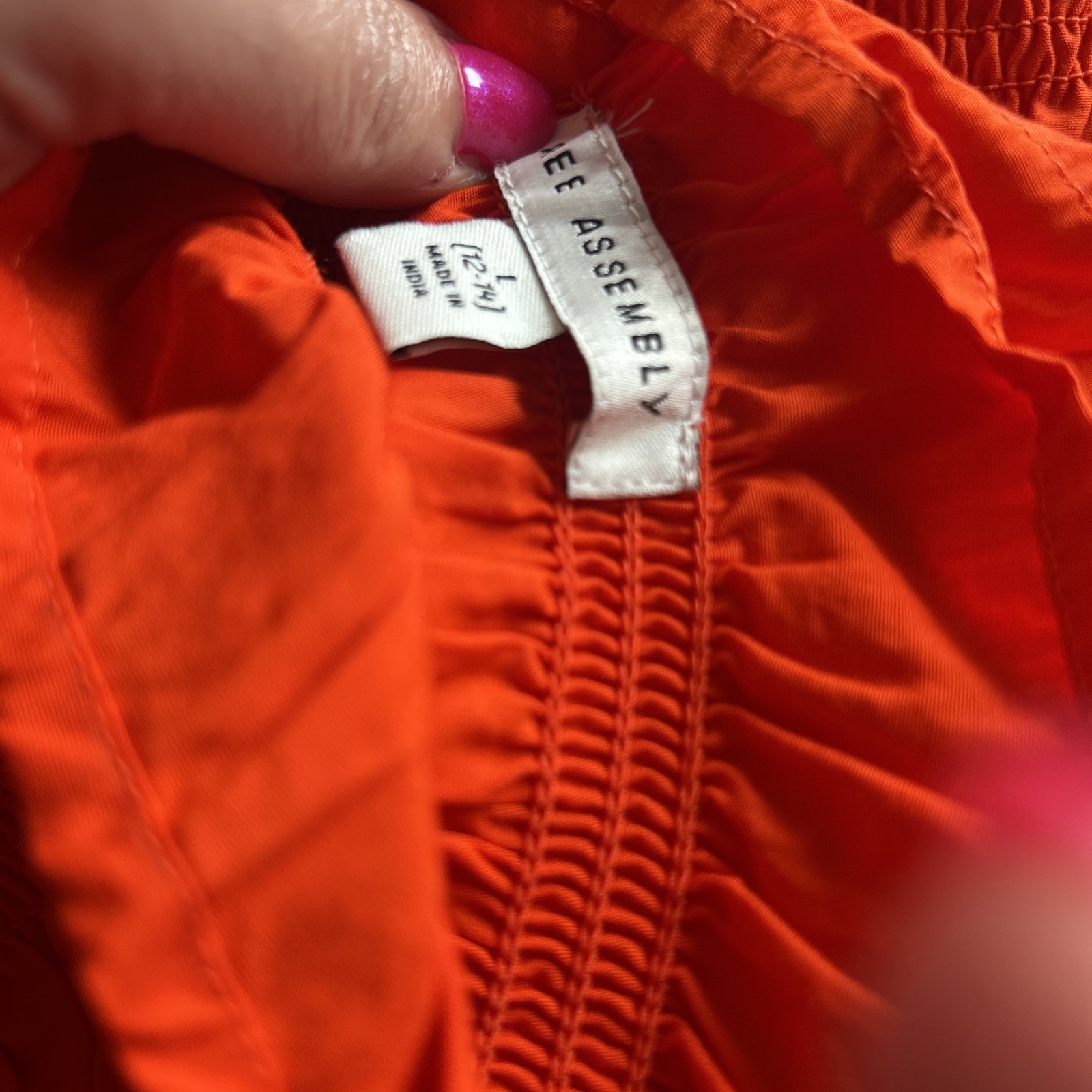 NWT Free Assembly Women’s L Smocked Orange Peplum Sleeveless Cotton Top