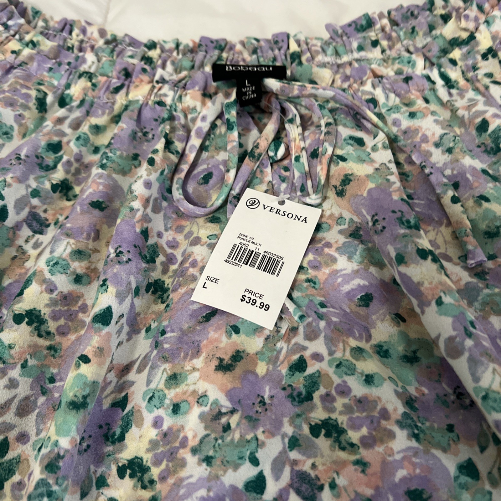 Versona multi-color (pastels) lightweight. Size Large New with tags.