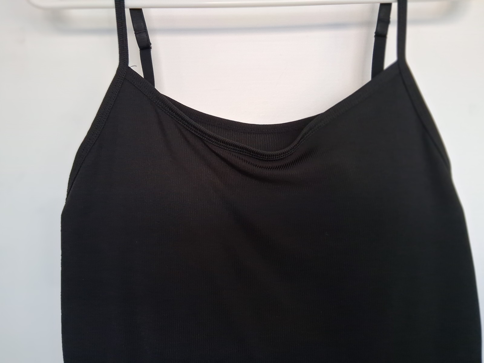 Size Small, black stretch cami w/ built in bra and adjustable straps. Excellent