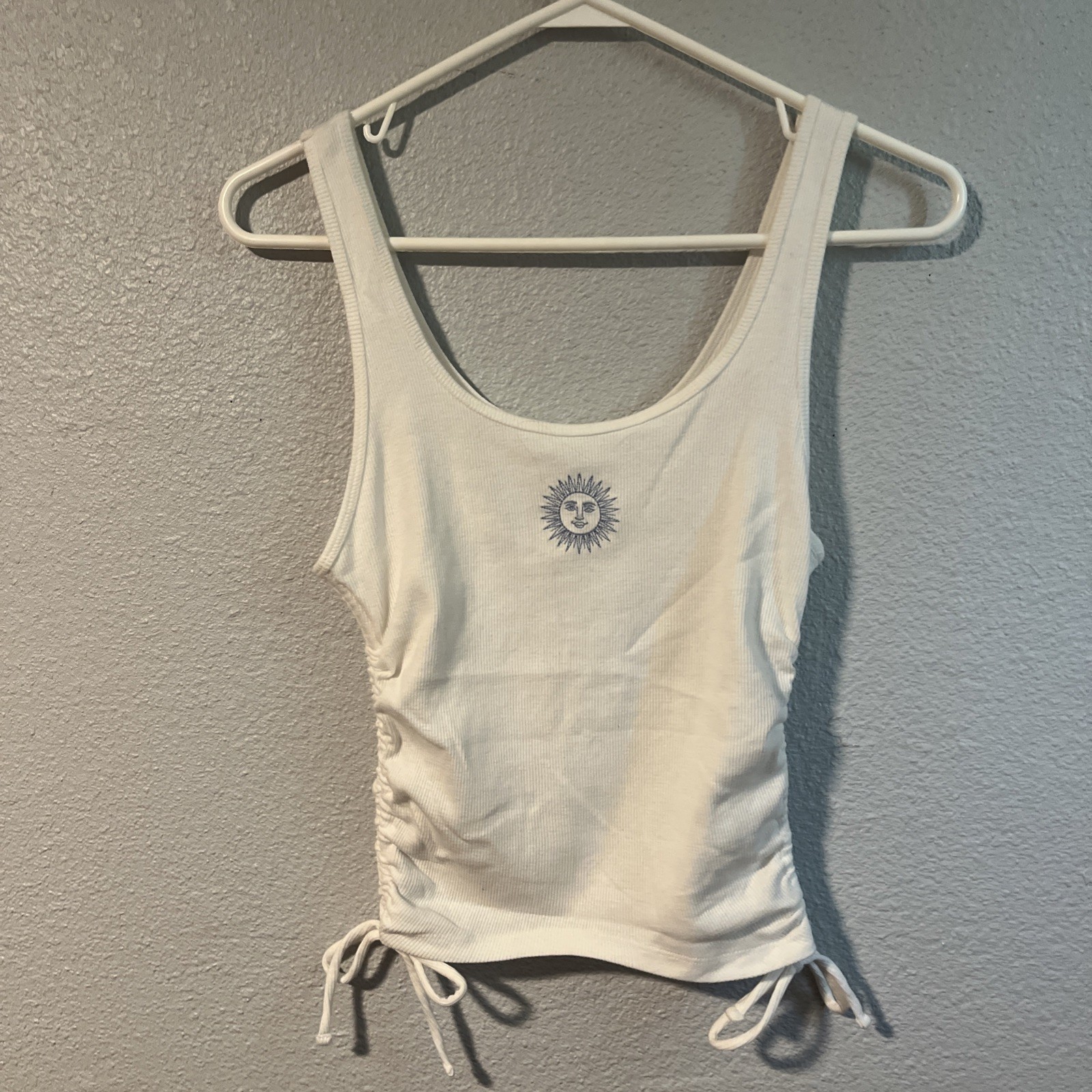 Hollister White Tank Top With Side Ties And A Blue Sun Detail Size Medium