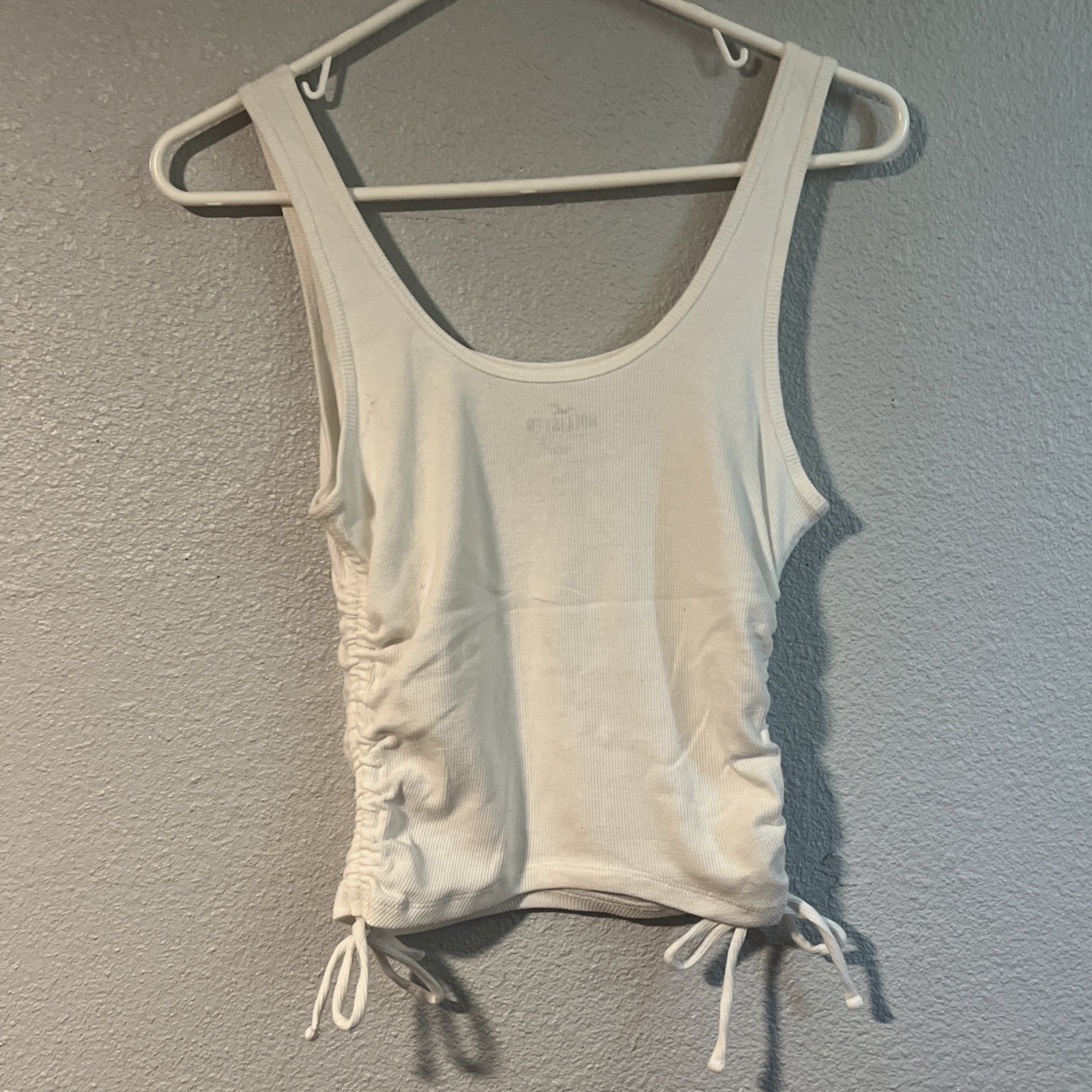 Hollister White Tank Top With Side Ties And A Blue Sun Detail Size Medium