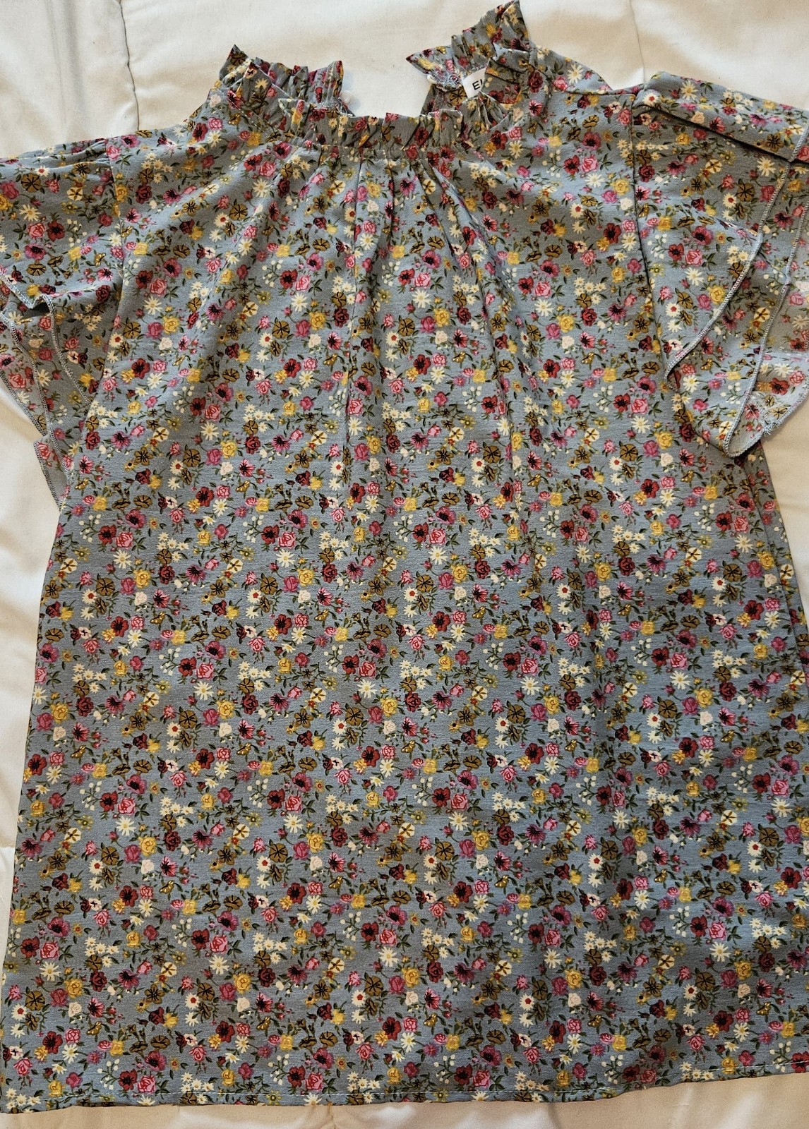 Elings brand women’s shirt, flower print with butterfly sleeves. Size medium.