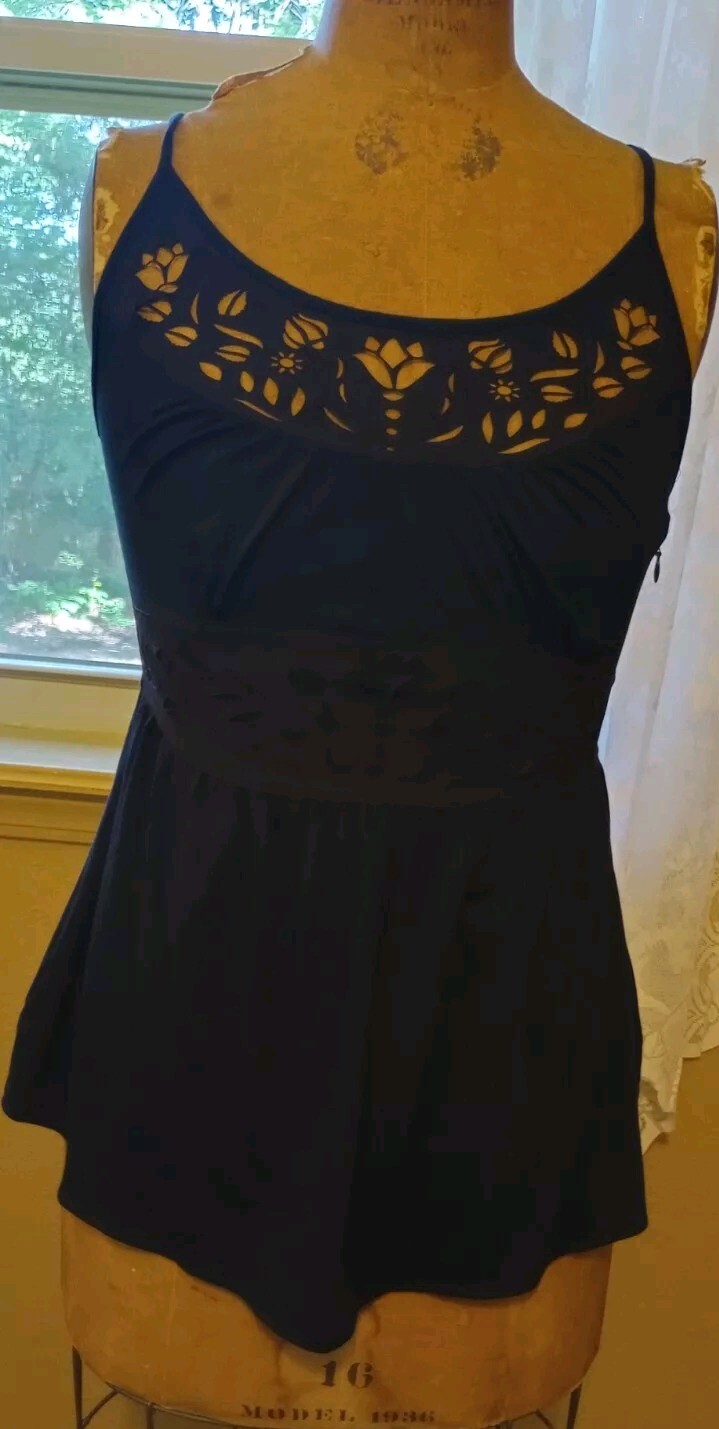 Black sleeveless top with criss cross straps and cutouts NWOT