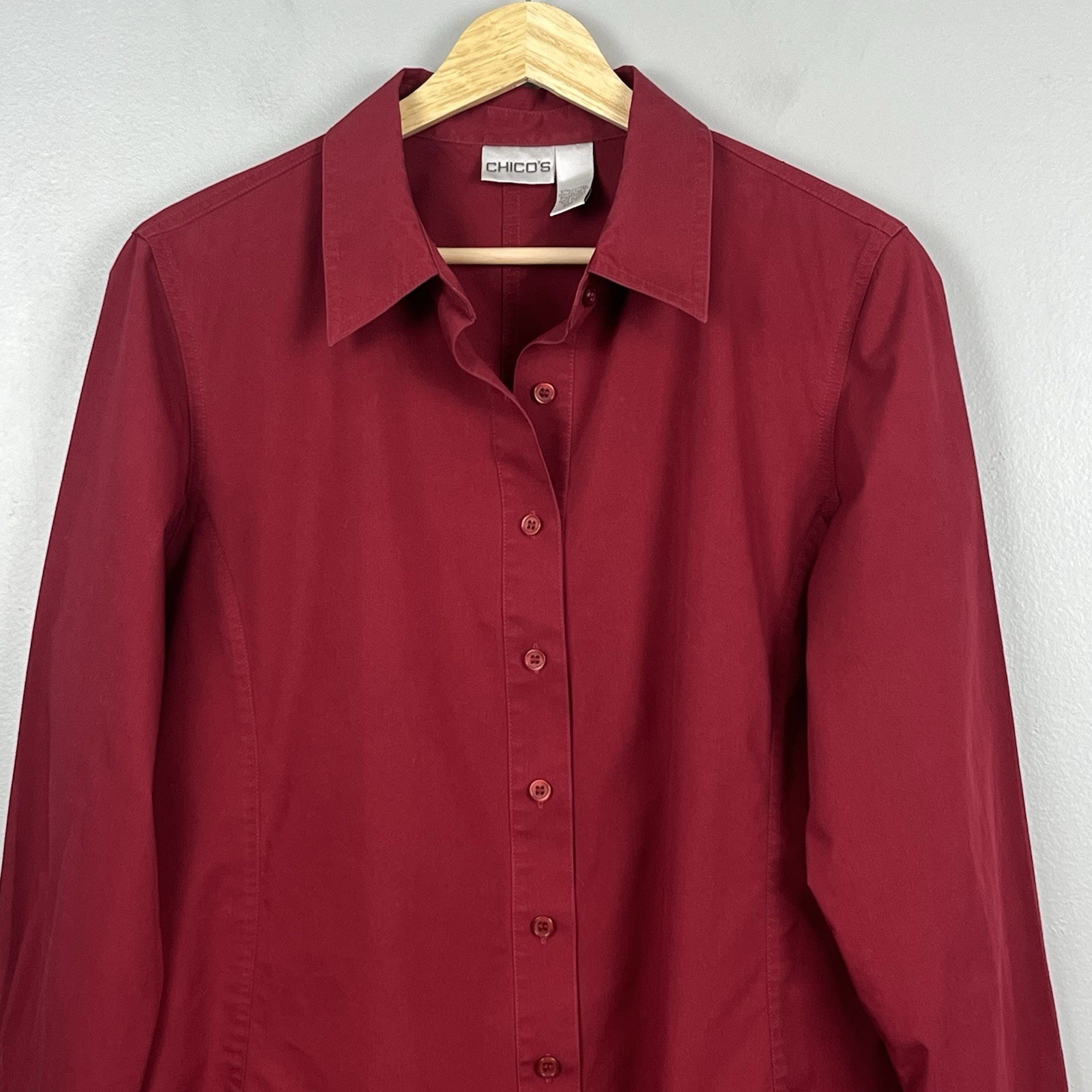 Chico’s red poly cotton spandex button front tunic length shirt, large.