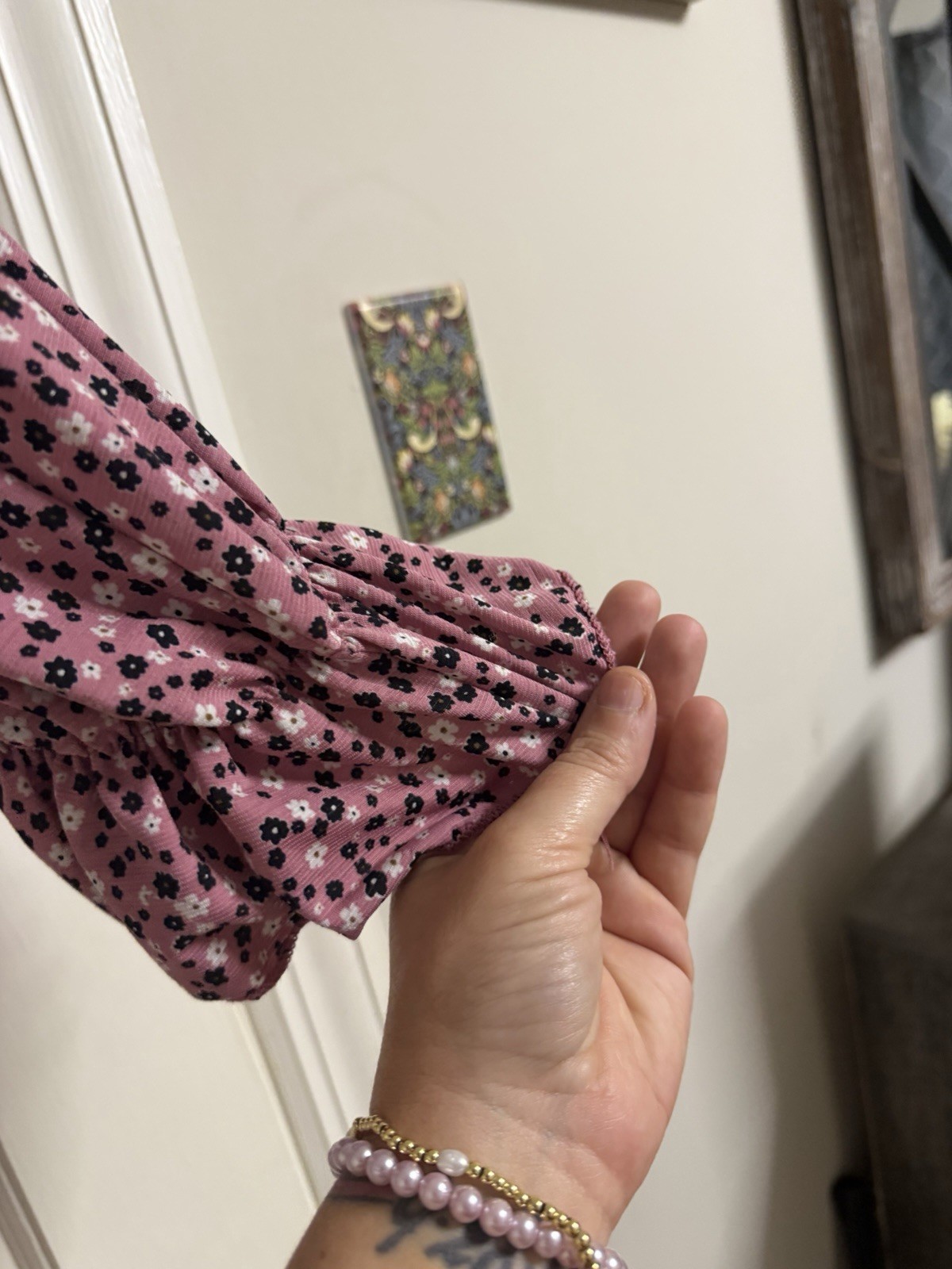 pink and black floral cold-shoulder top has a vibrant all-over flower design m