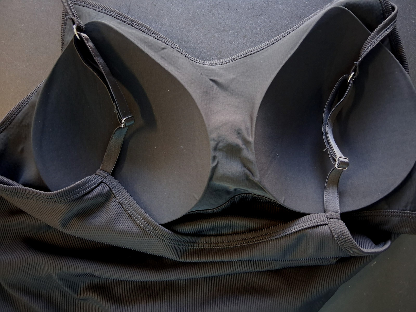 Size Small, black stretch cami w/ built in bra and adjustable straps. Excellent