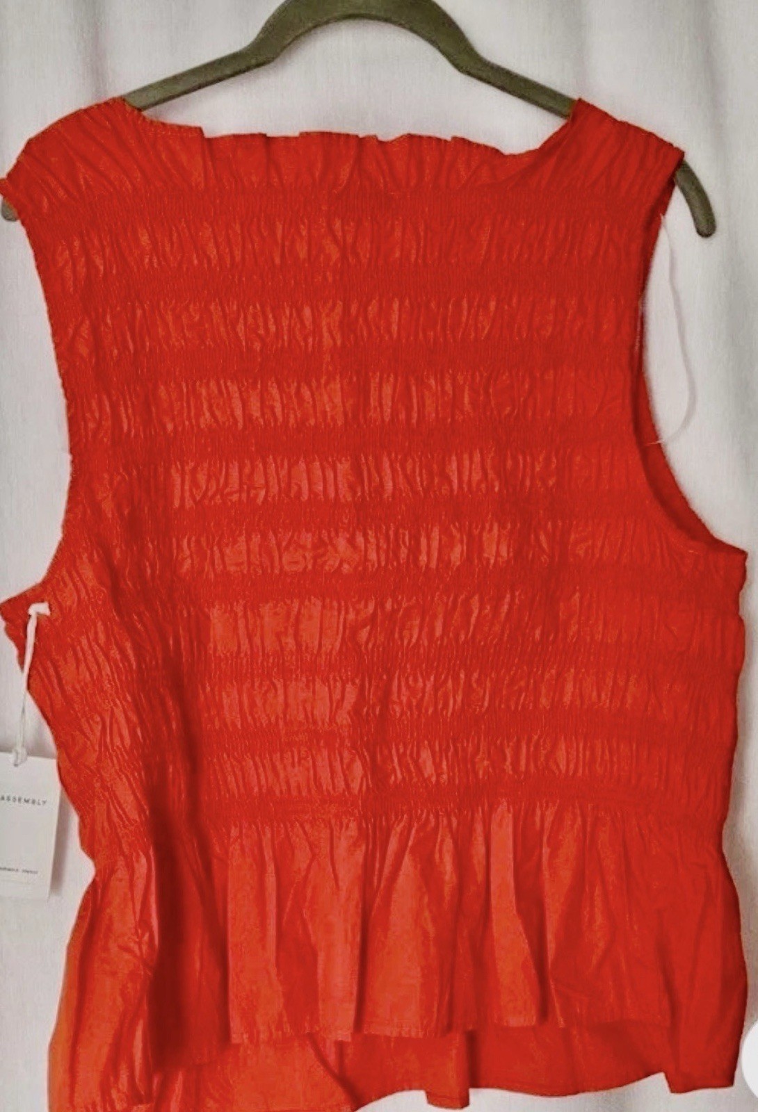 NWT Free Assembly Women’s L Smocked Orange Peplum Sleeveless Cotton Top