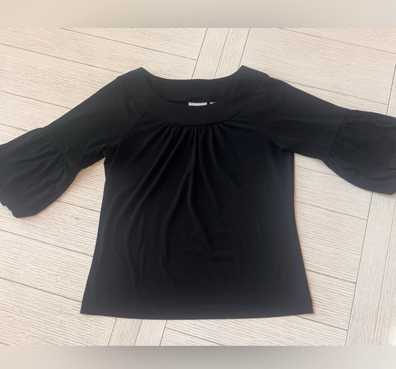 Chicos basic black top w/ bubble sleeves. Size 1/M. poly/spandex blend