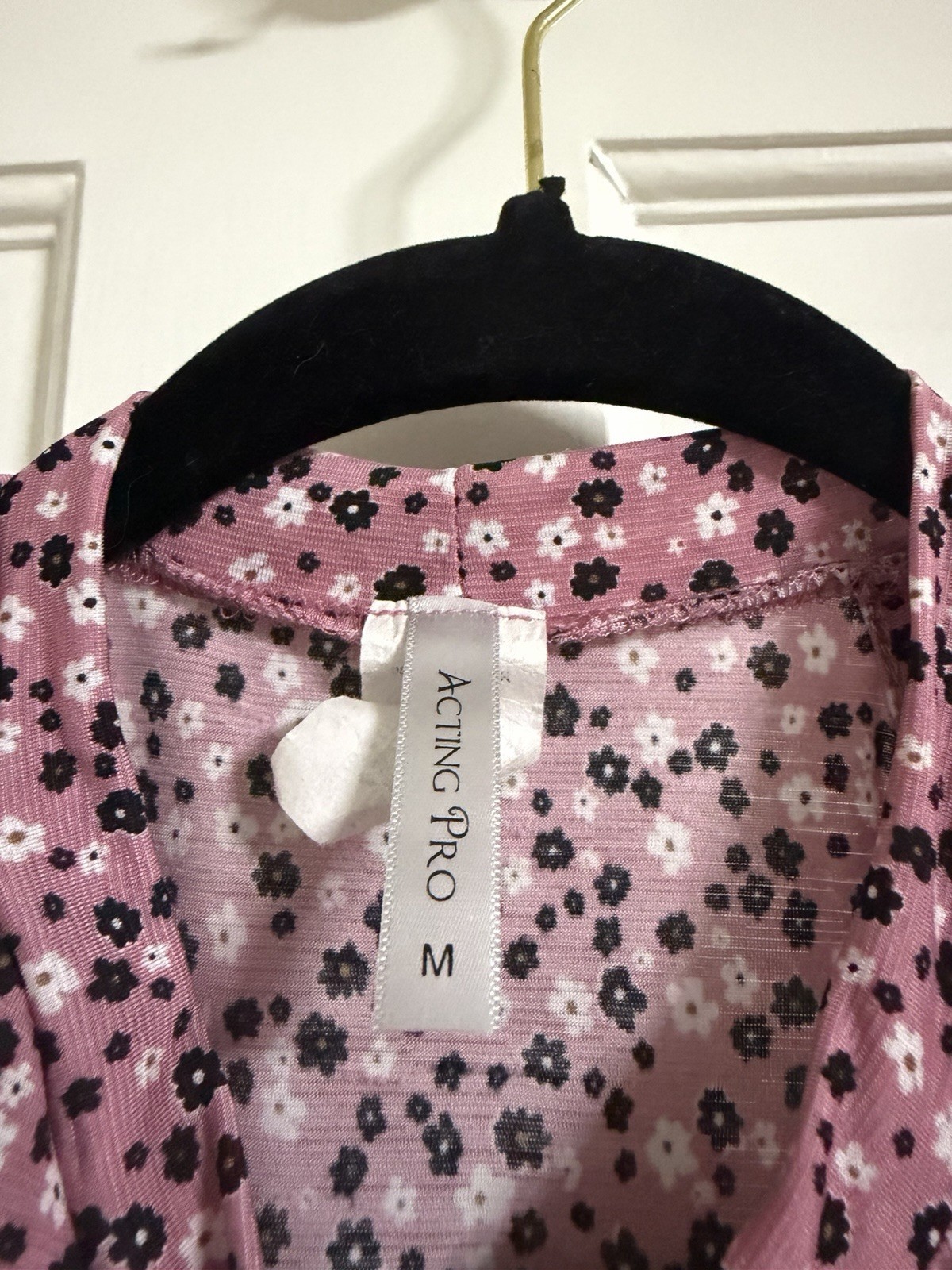 pink and black floral cold-shoulder top has a vibrant all-over flower design m