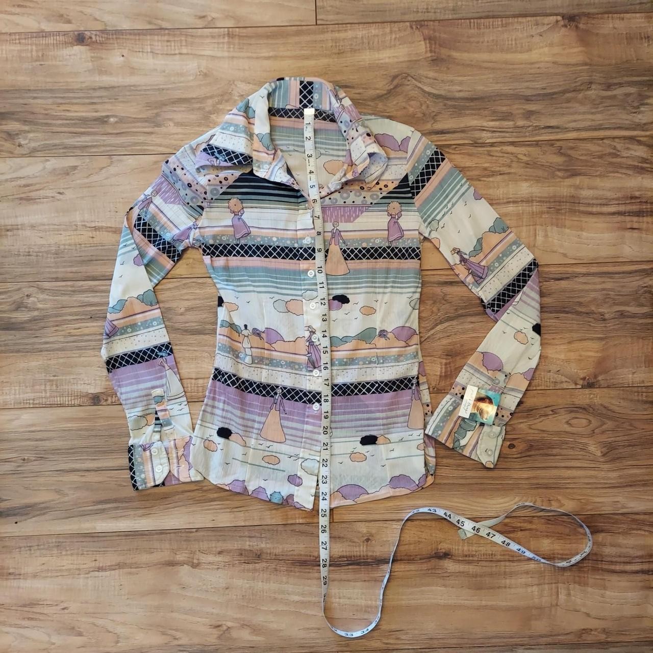 Multi-colored button-up shirt with graphic of women in dresses