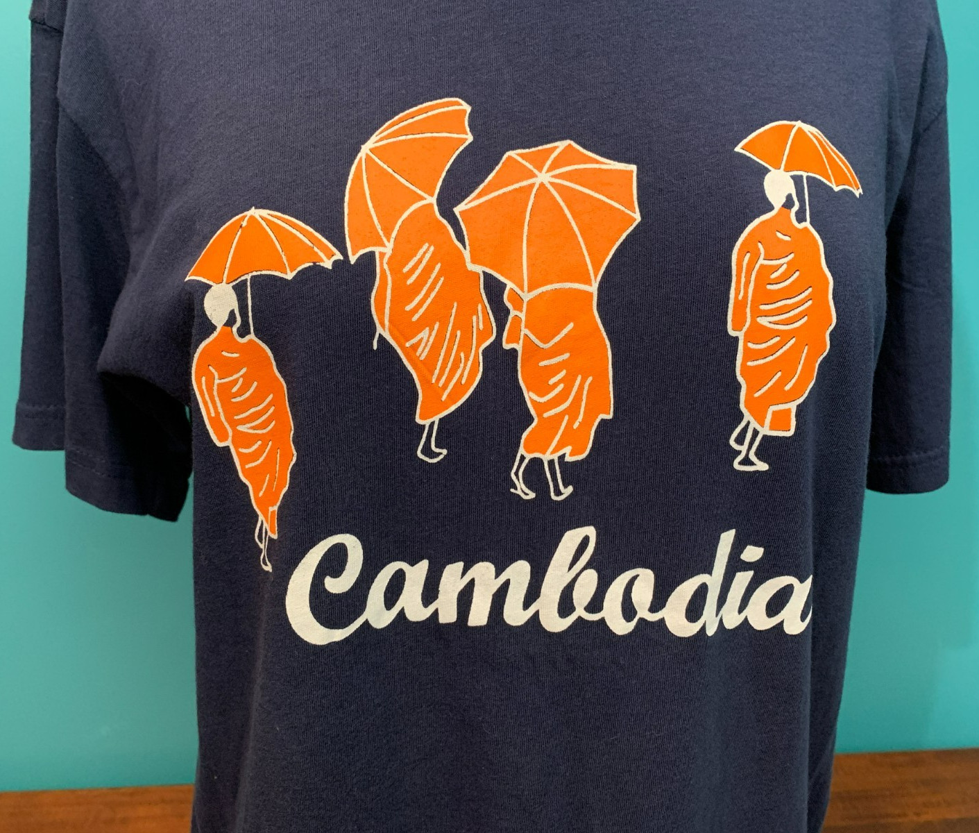 Cambodia Monks with Umbrellas Women’s T-Shirt – Size Medium, Blue & Orange