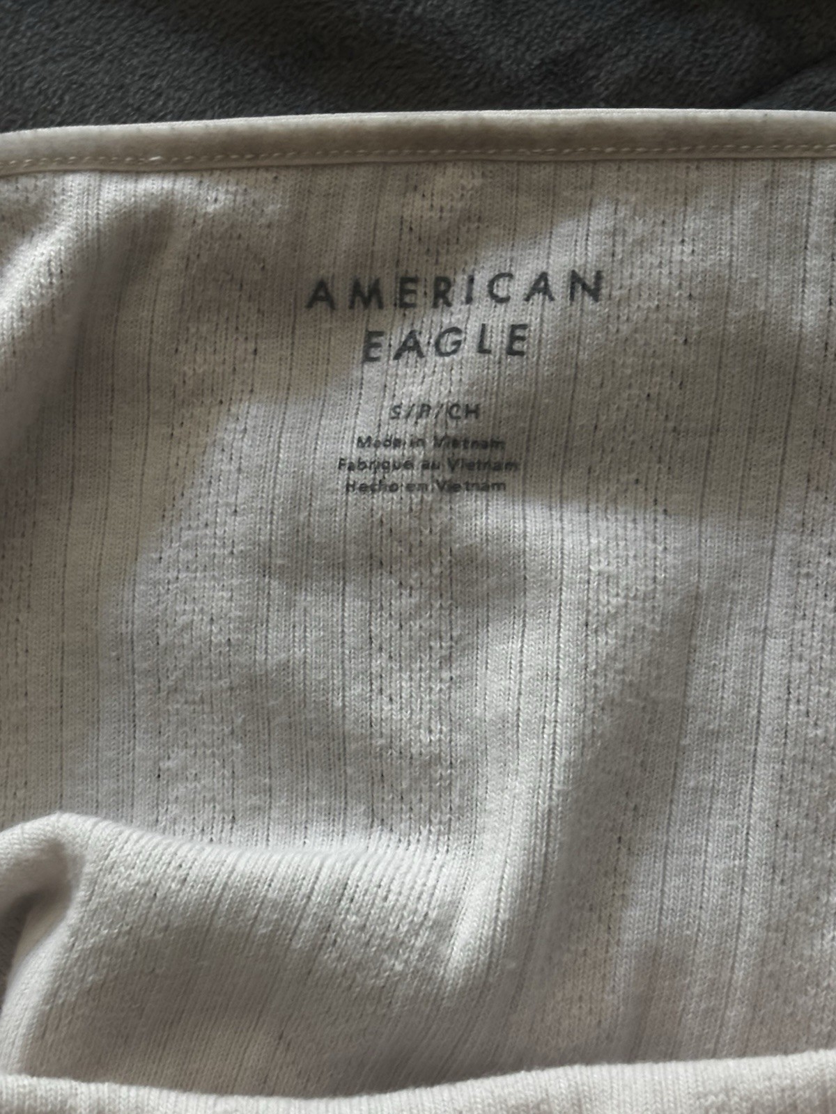 American Eagle baby pink ribbed tank top with vertical textured stripes, size S