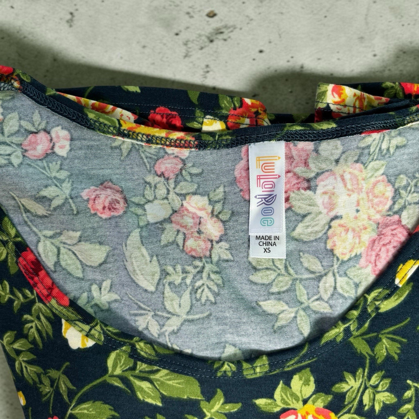 LuLaRoe Perfect T Shirt Women’s Size XS Navy Blue Red Yellow Floral Swing Top