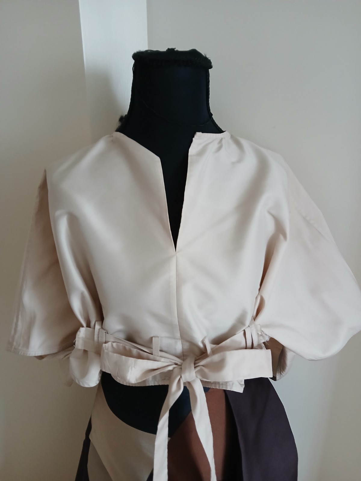 tome polyester silk feel full of body tie front top longer back