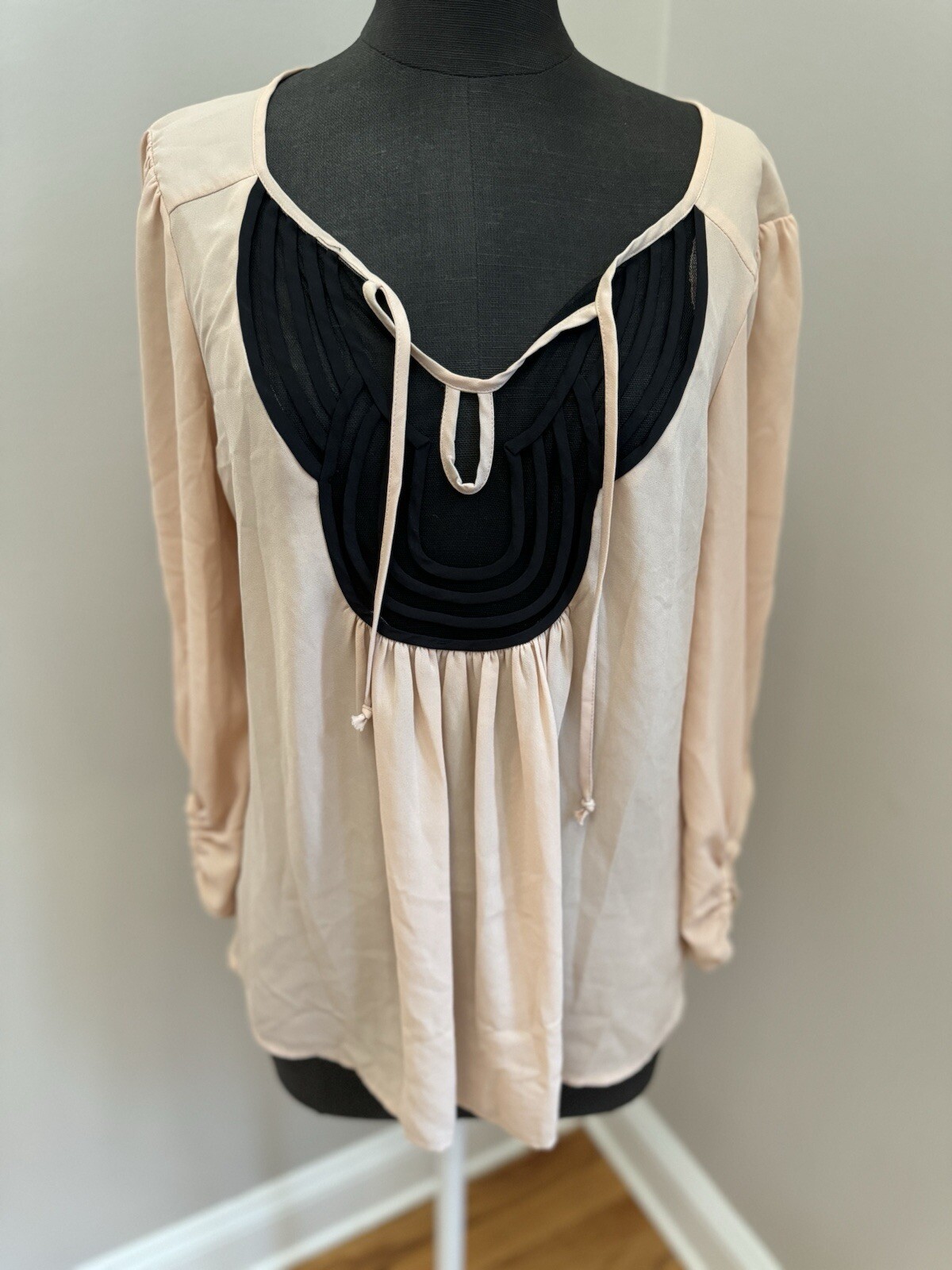 Black Rainn M blush colored blouse with sheer black neckline and tie front, EUC