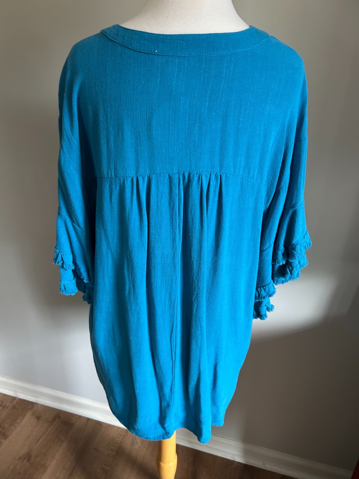 Umgee Teal Linen Blend Umgee Top with Split V Neck, Frayed Edge Sleeves and Hem