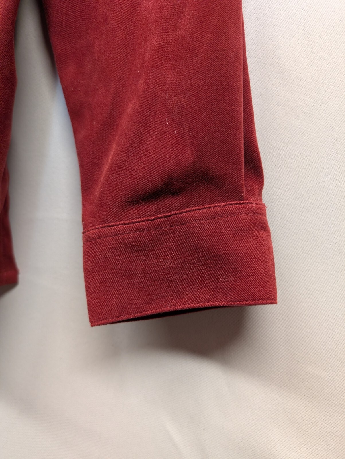 Cascade Blues. Red Rust, long sleeve, crystal button up front top. size L
