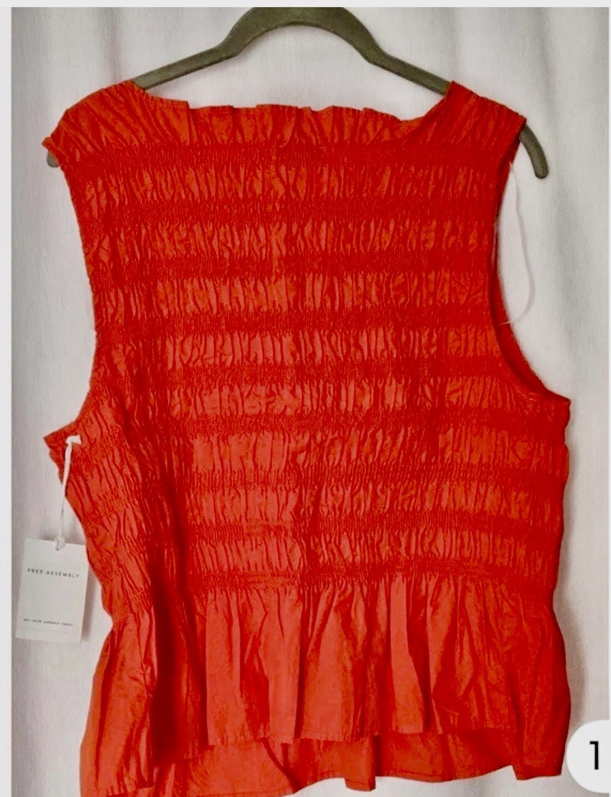 NWT Free Assembly Women’s L Smocked Orange Peplum Sleeveless Cotton Top