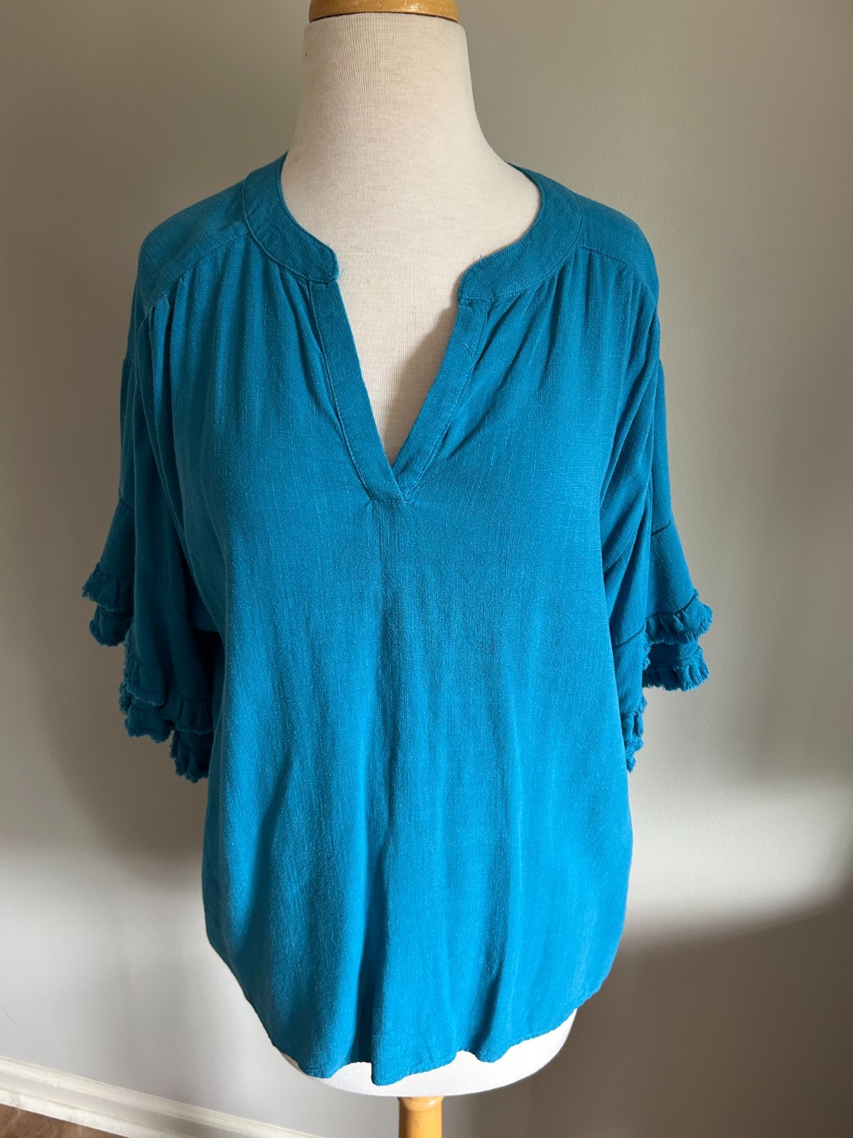 Umgee Teal Linen Blend Umgee Top with Split V Neck, Frayed Edge Sleeves and Hem