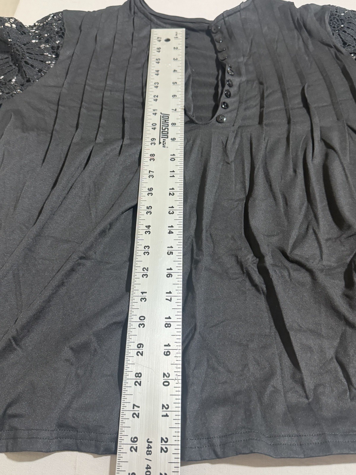 Black polyester & spandex blouse with lace sleeves and button-up front size 2XL