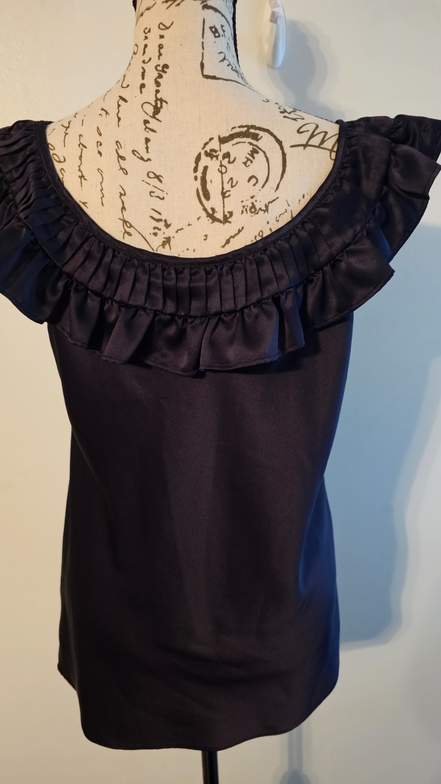 NWOT Allen B. Schwartz Black satin like top w/ a distinctive ruffle/pleated coll