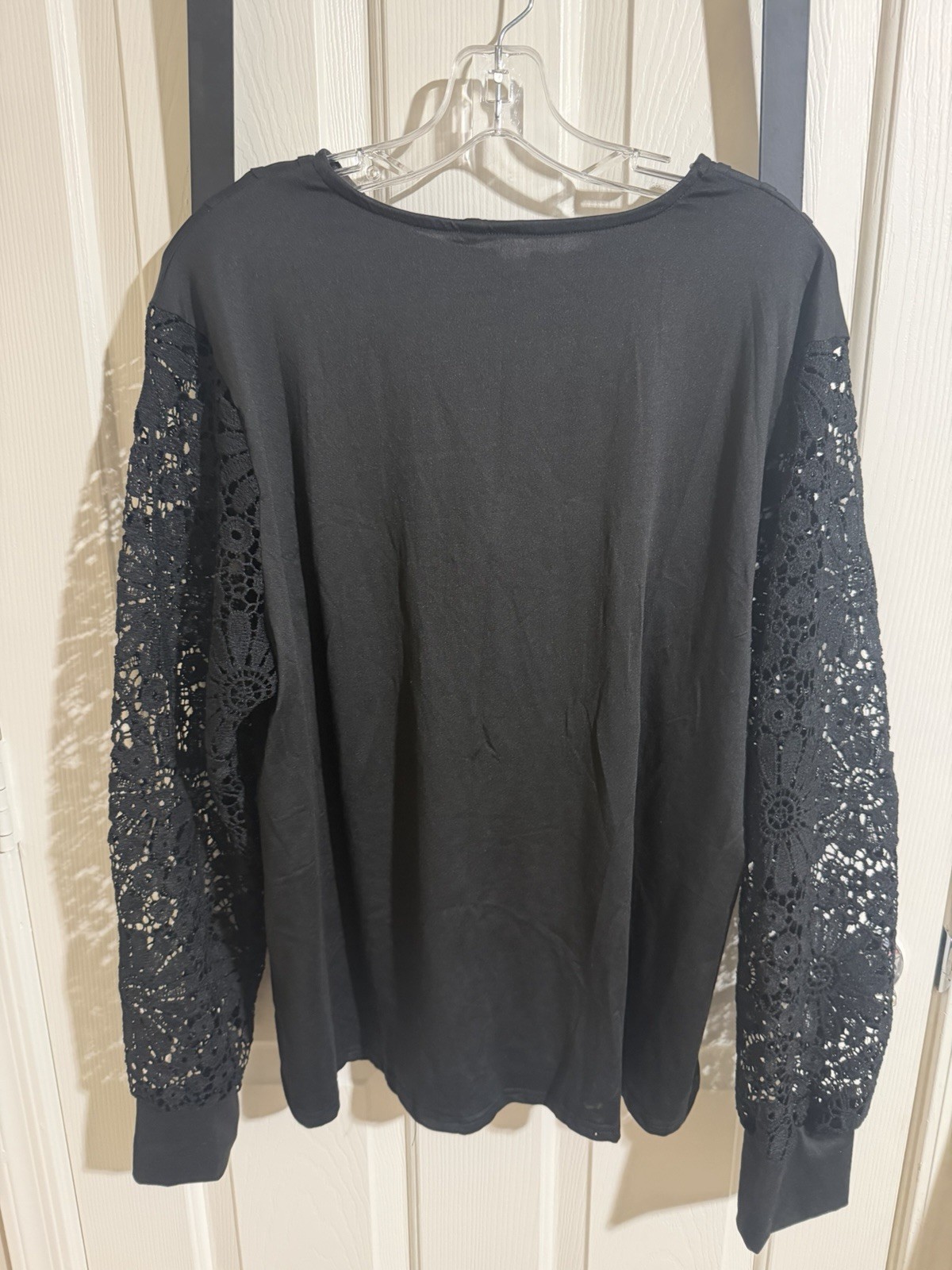 Blackpolyester & spandex blouse with lace sleeves and button-up front size 2XL