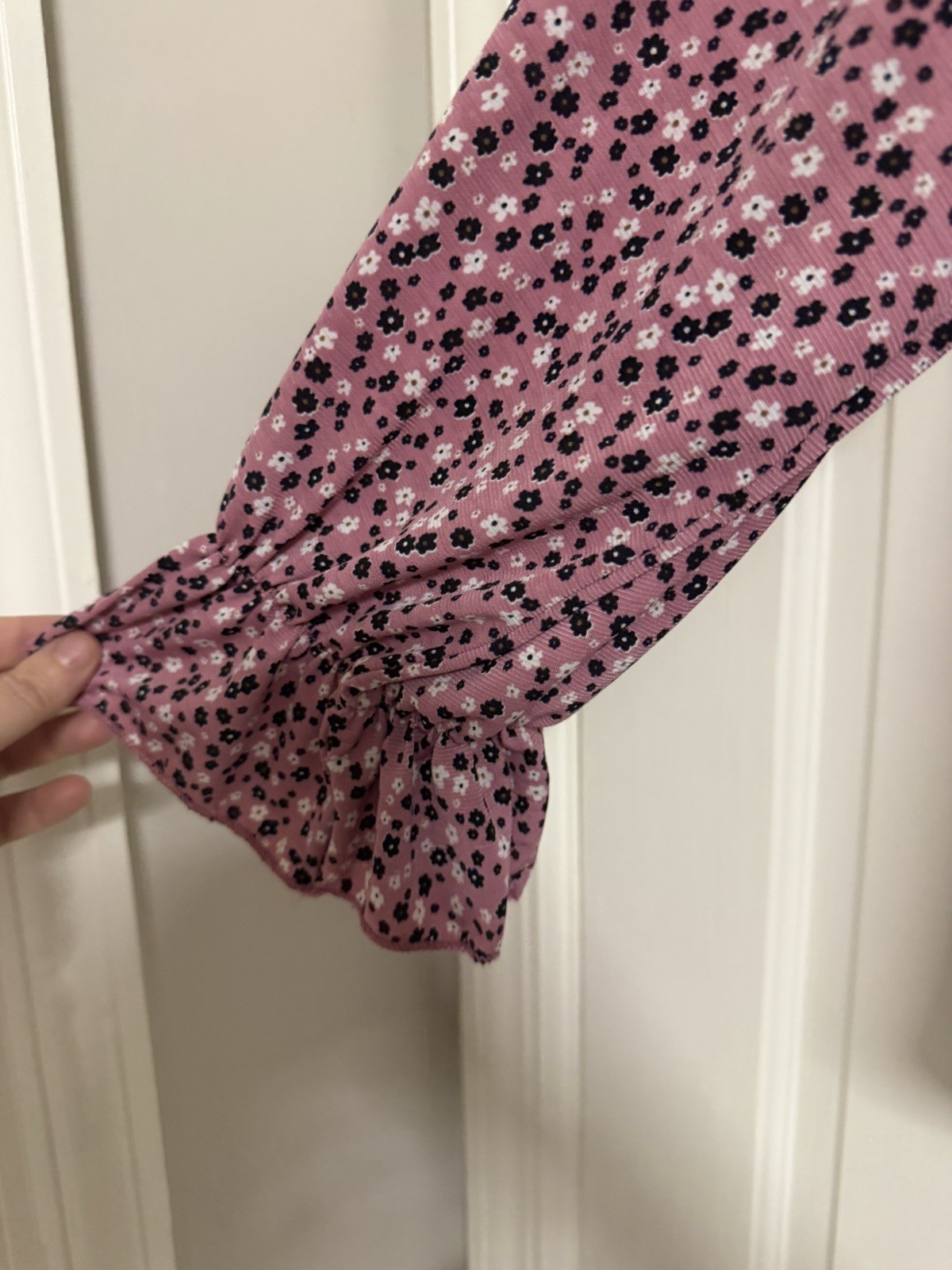 pink and black floral cold-shoulder top has a vibrant all-over flower design m