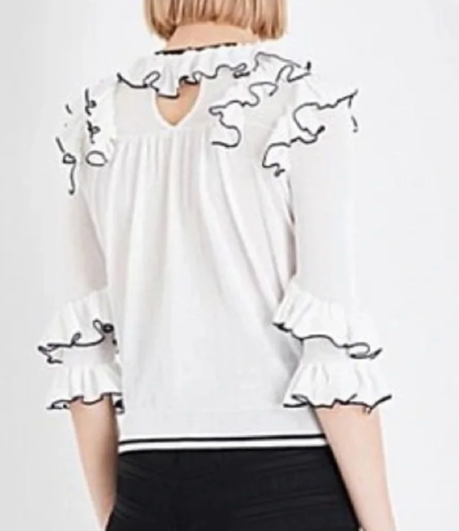 Womens blouse; Maje cream with ruffles with black piping
