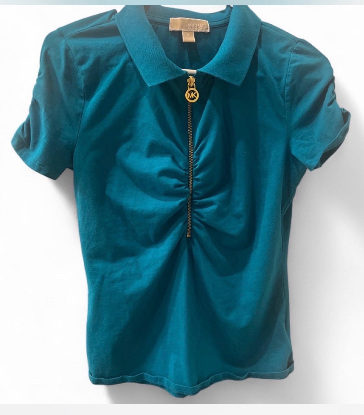 Michael Kors teal zip up polo. Features a ruched front and gold tone MK zipper