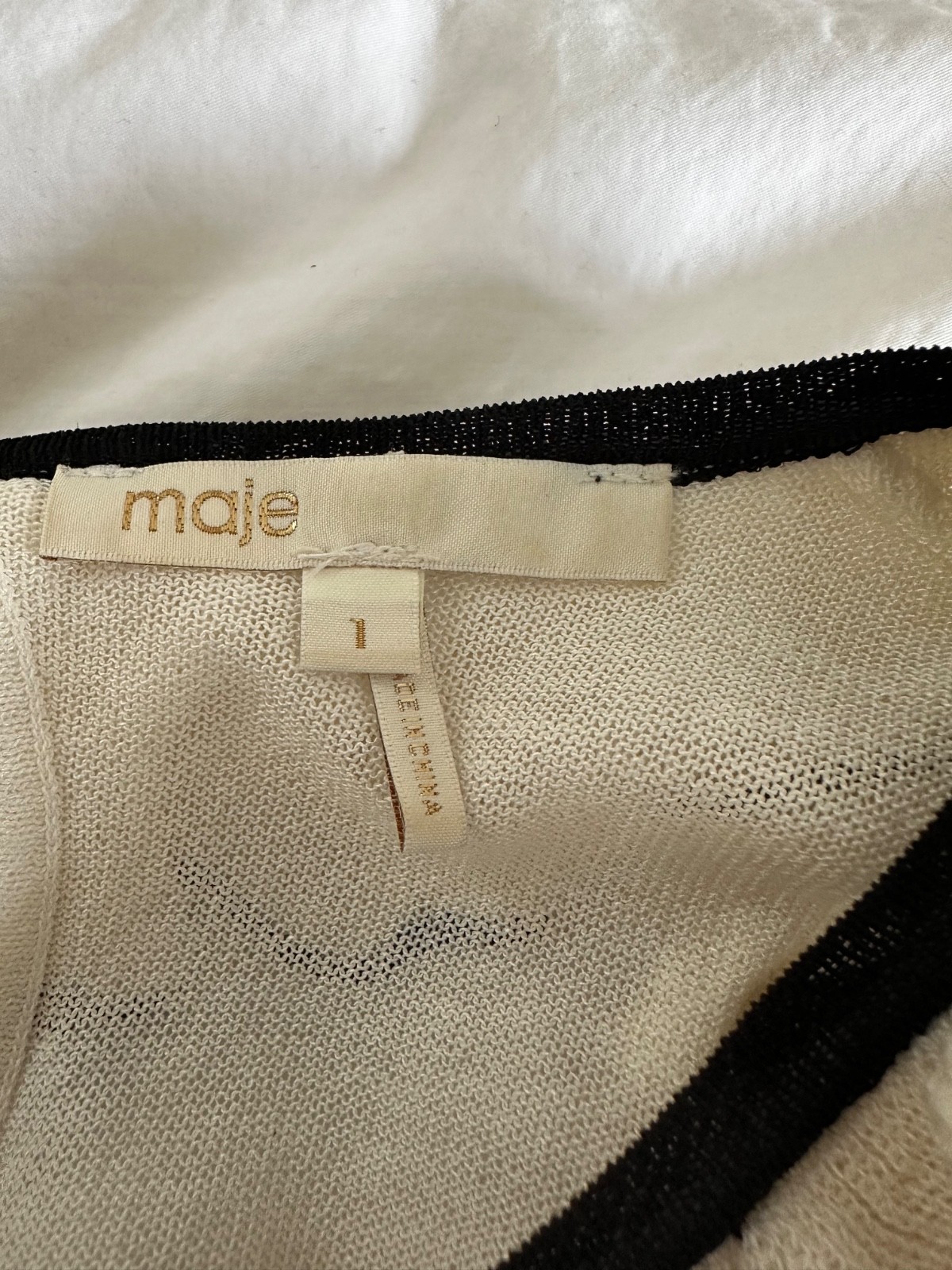 Womens blouse; Maje cream with ruffles with black piping