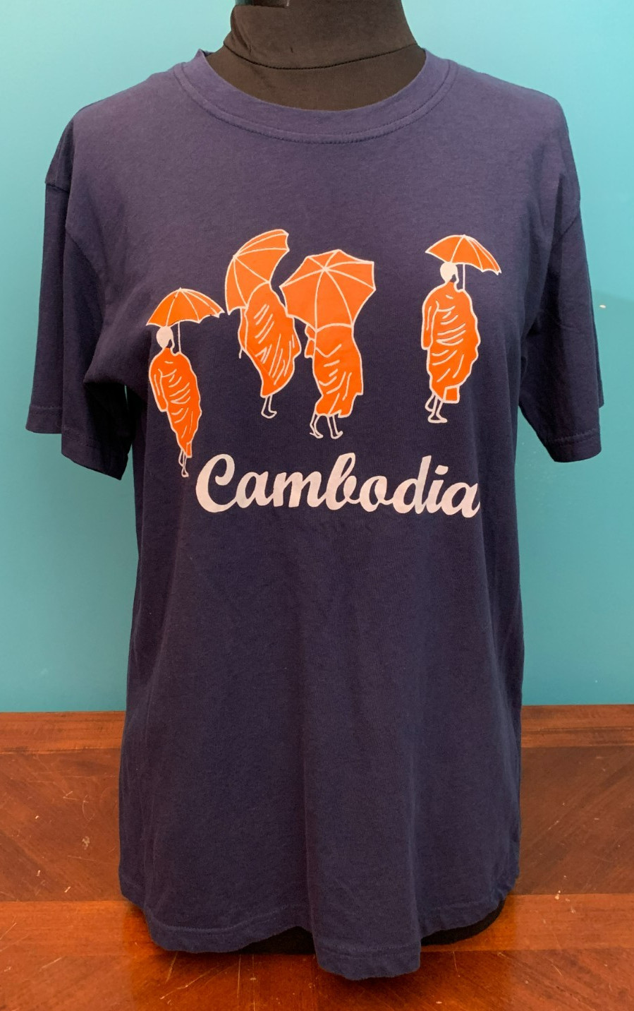 Cambodia Monks with Umbrellas Women’s T-Shirt – Size Medium, Blue & Orange