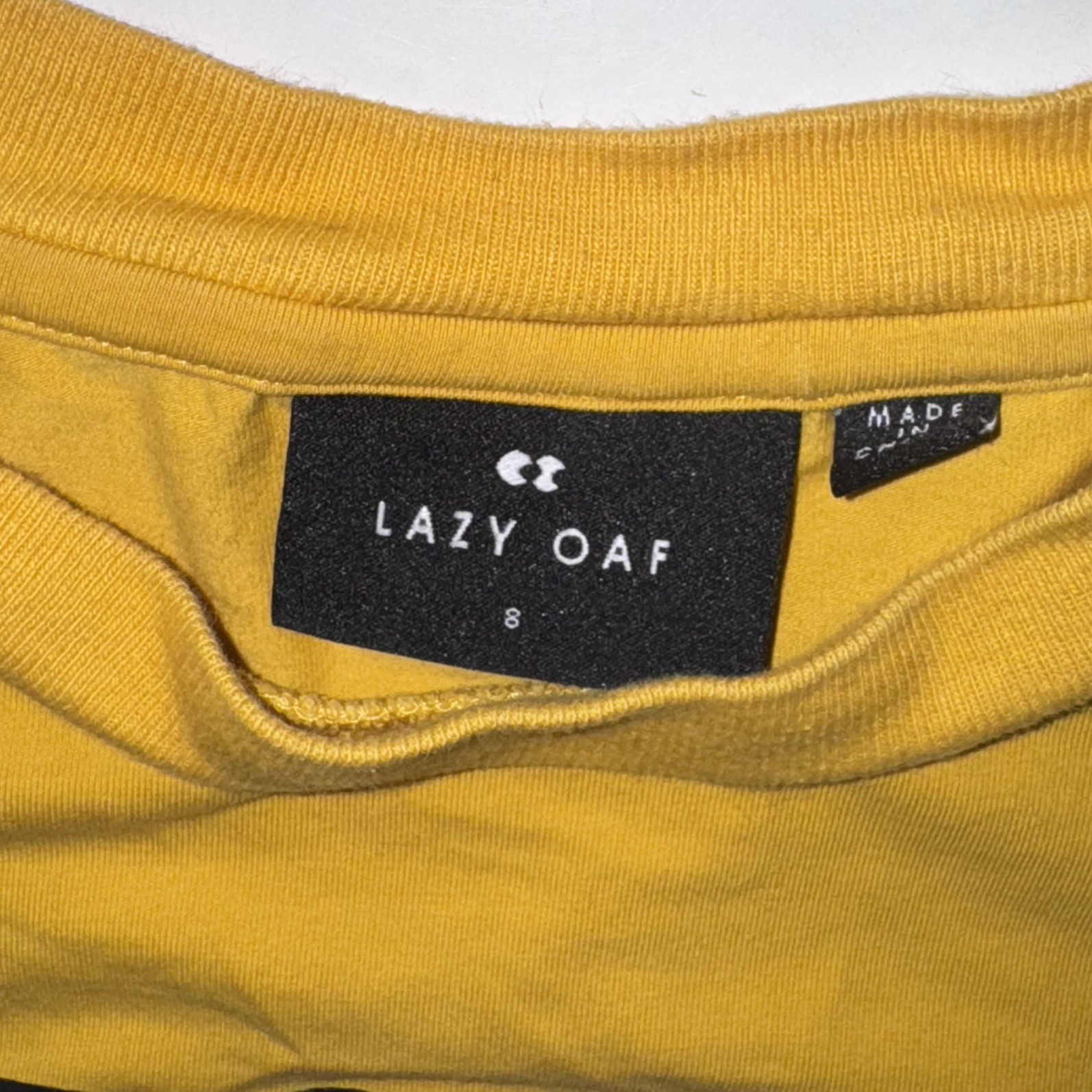 Lazy Oaf Pony yellow graphic tee size 8 crop raw edge