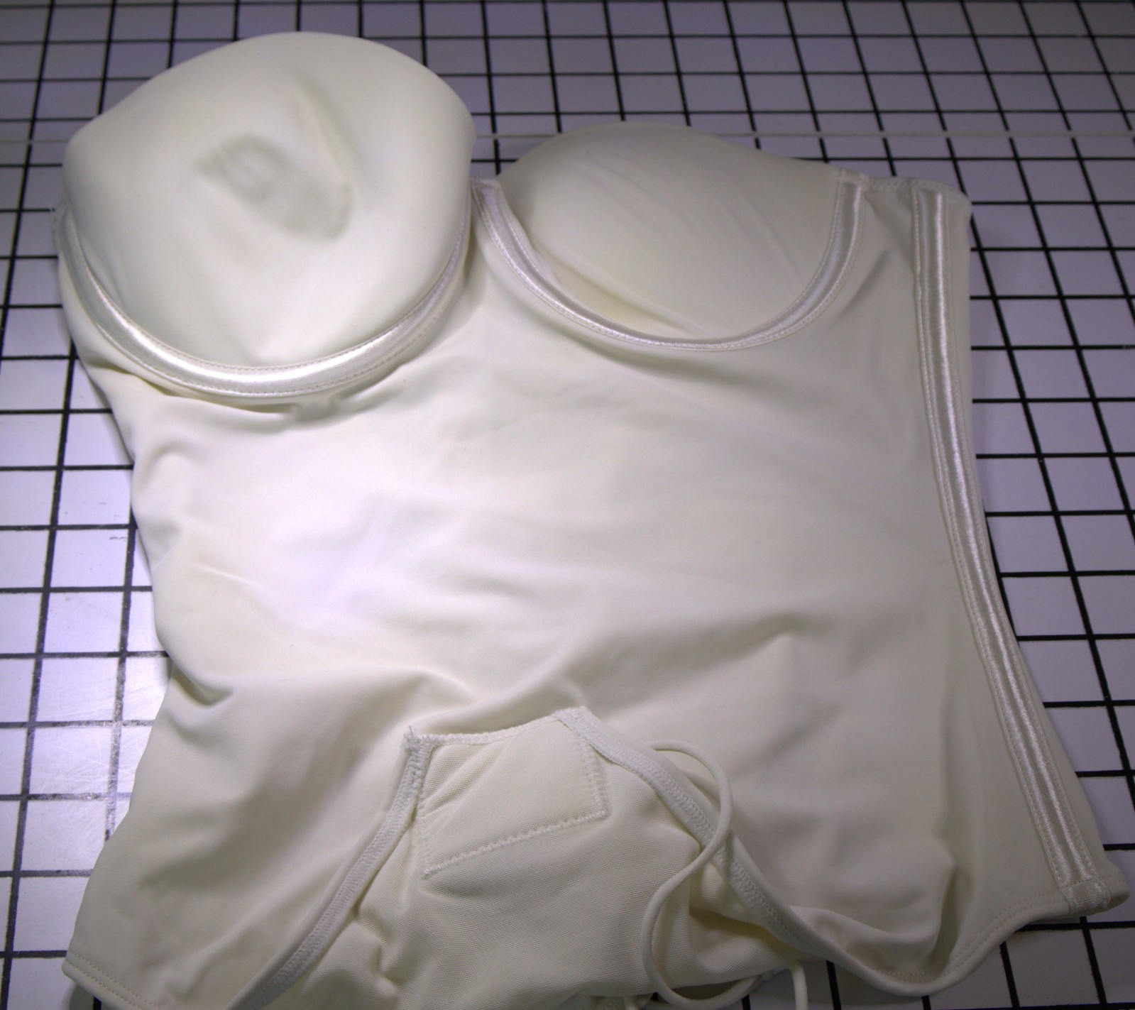 Cream colored t shaped body suit size small