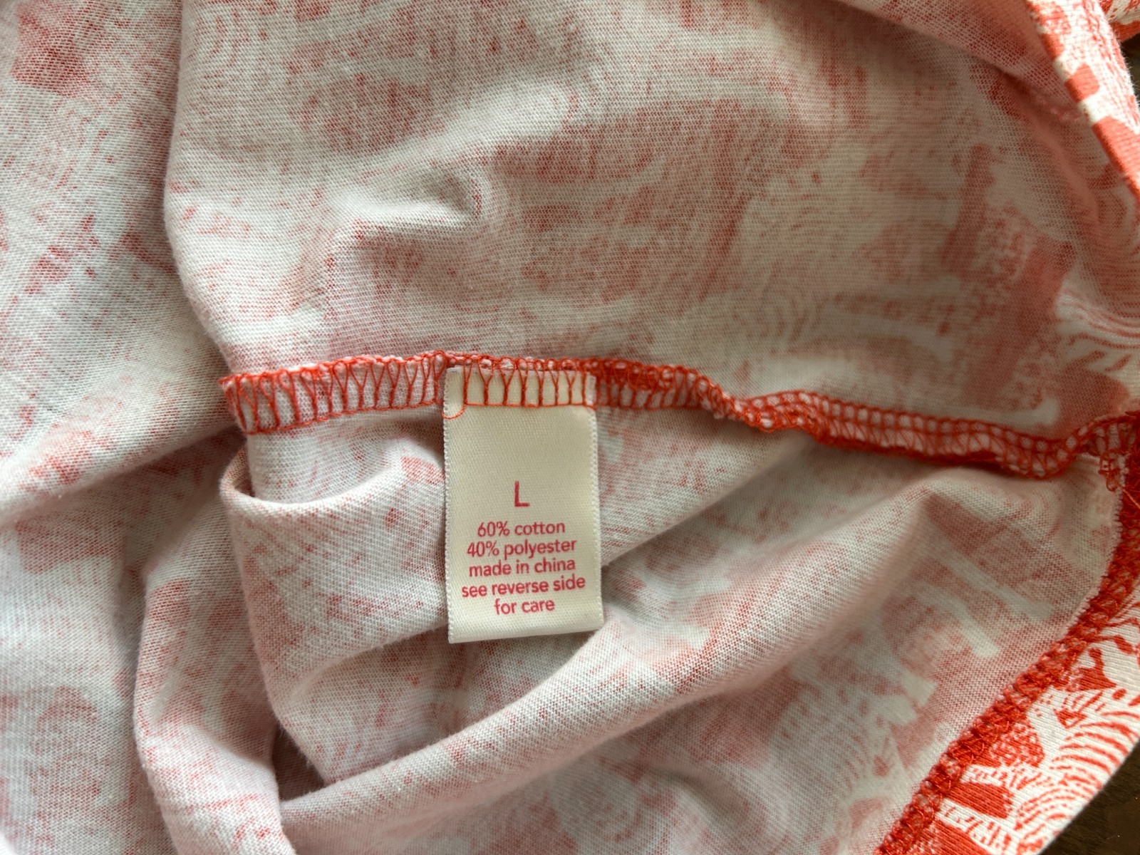 Orange & white top with zebra pattern blouse Size L V neck short sleeve pullover