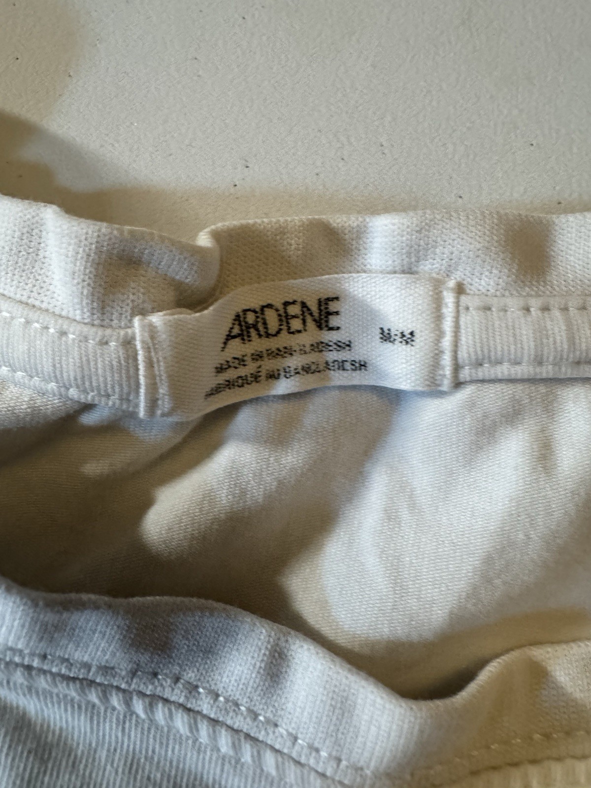 Ardene size medium crop white tee. With butterfly design.