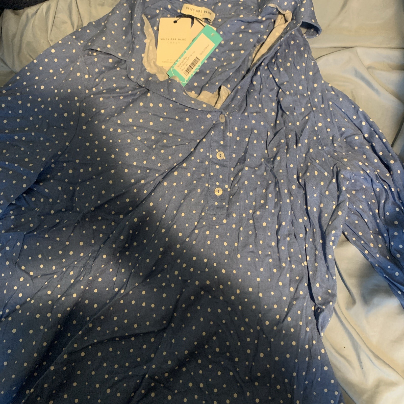 Skies are blue curvy 3/4 sleeve roll tab top