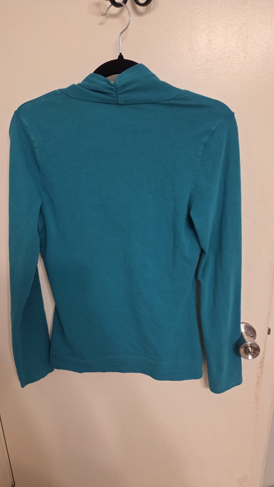Express V-neck top featuring a distinct ruched neckline detail. Size S