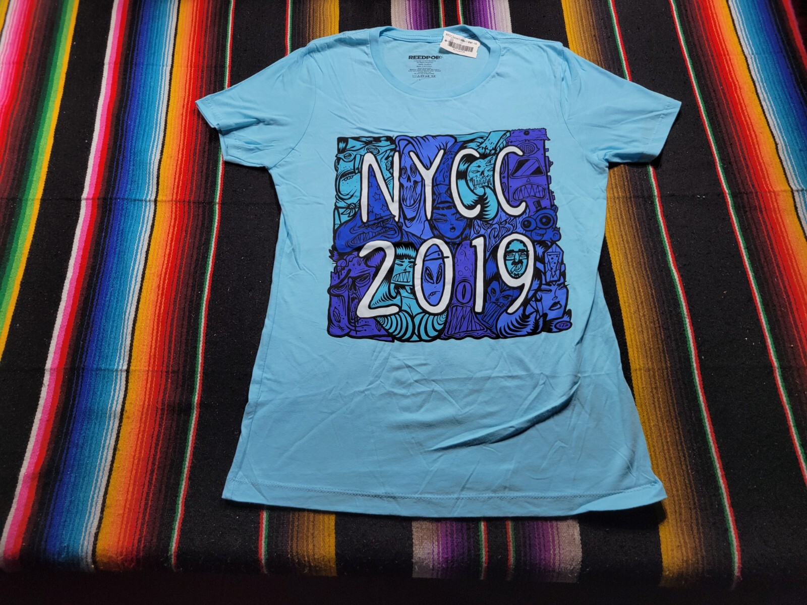 New York Comic Con NYCC 2019 Exclusive Women’s T-Shirt Size Large 17.5×27