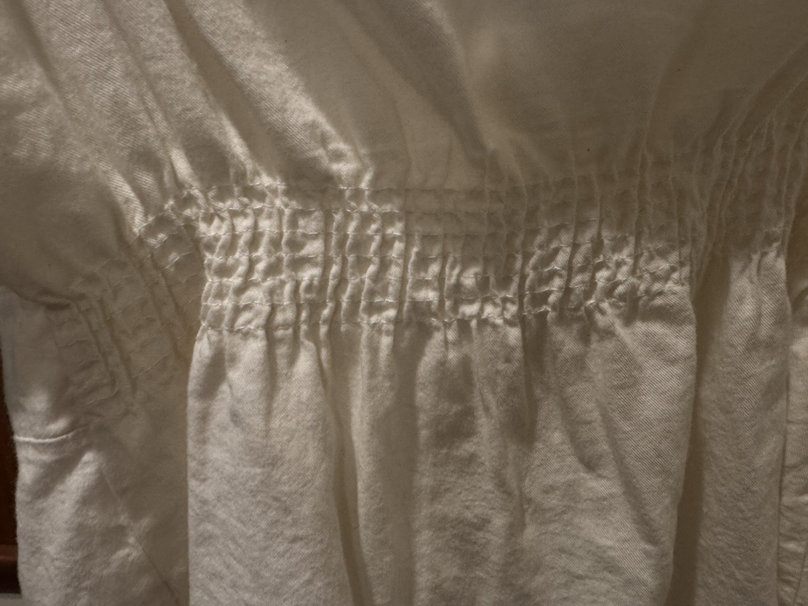 Brandy Melville cream camisole with thin adjustable spaghetti straps.